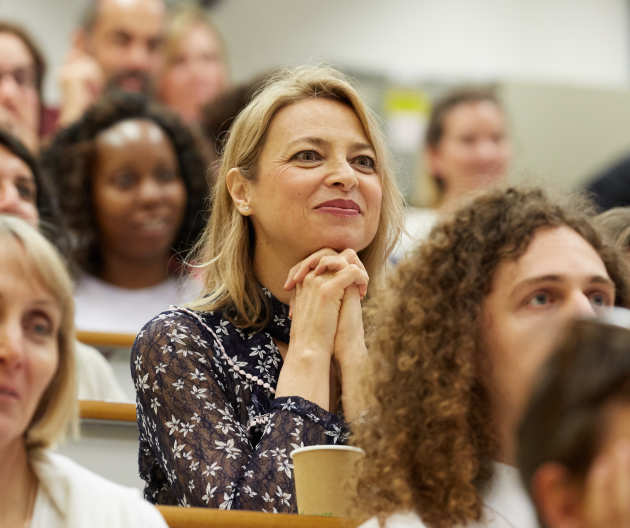 Woman at the 2018 Engagement Day watching a presentation