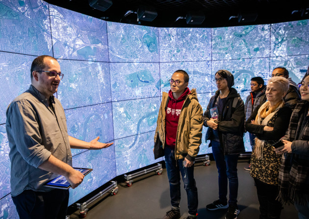 Researcher talking to the public at the Data Science Institute