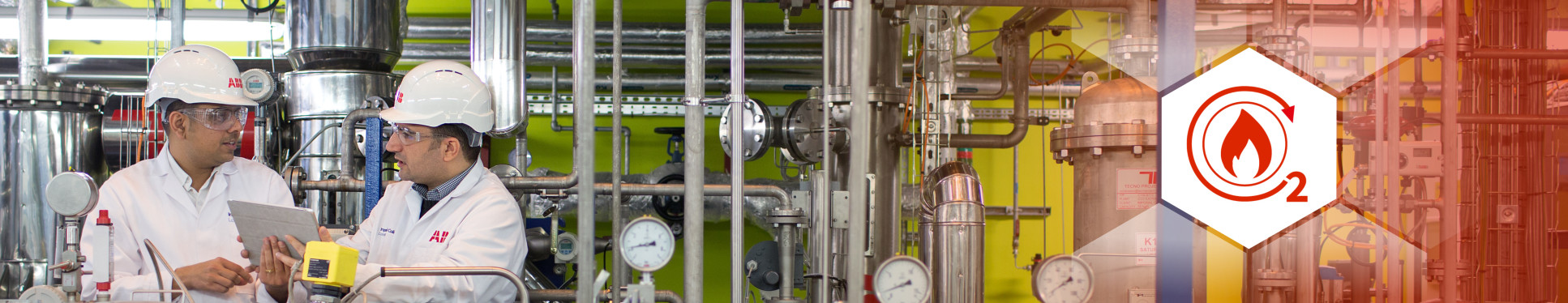 Two men in white coats in Imperial's carbon capture and storage plant