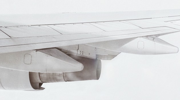 Image showing an aeroplane wing and engine. Photo by Jens Kreuter on Unsplash