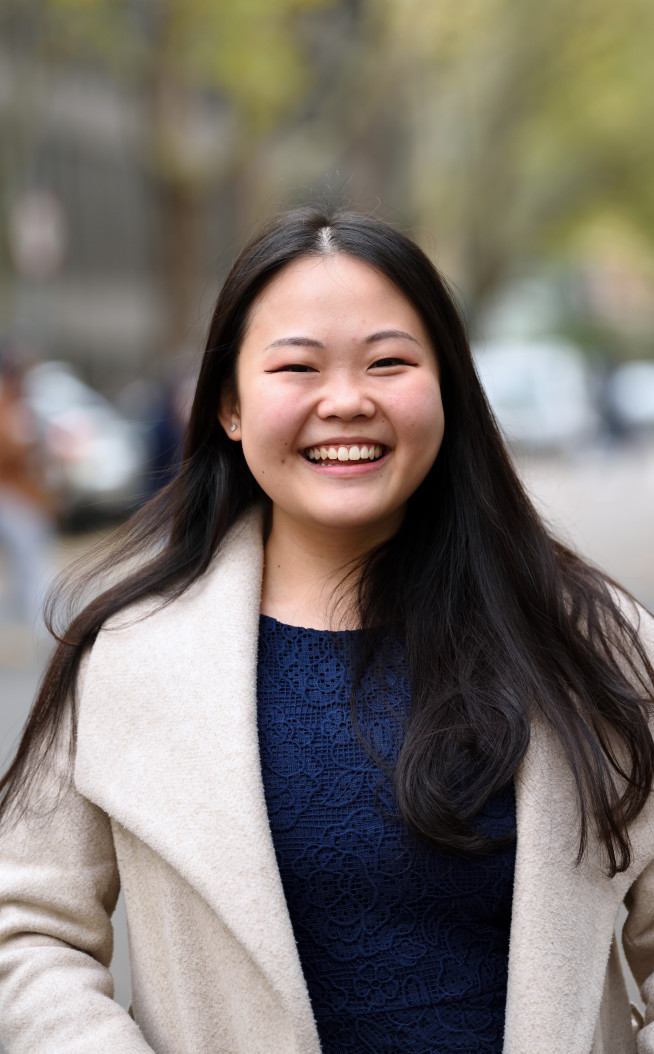 Student smiles at the camera