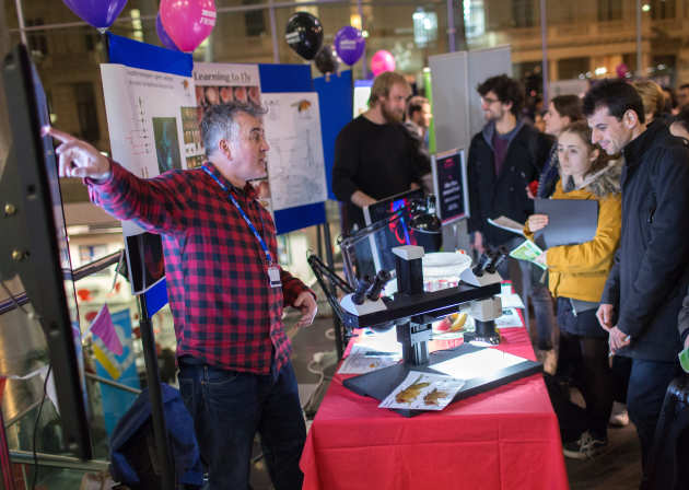 Staff member explaining science