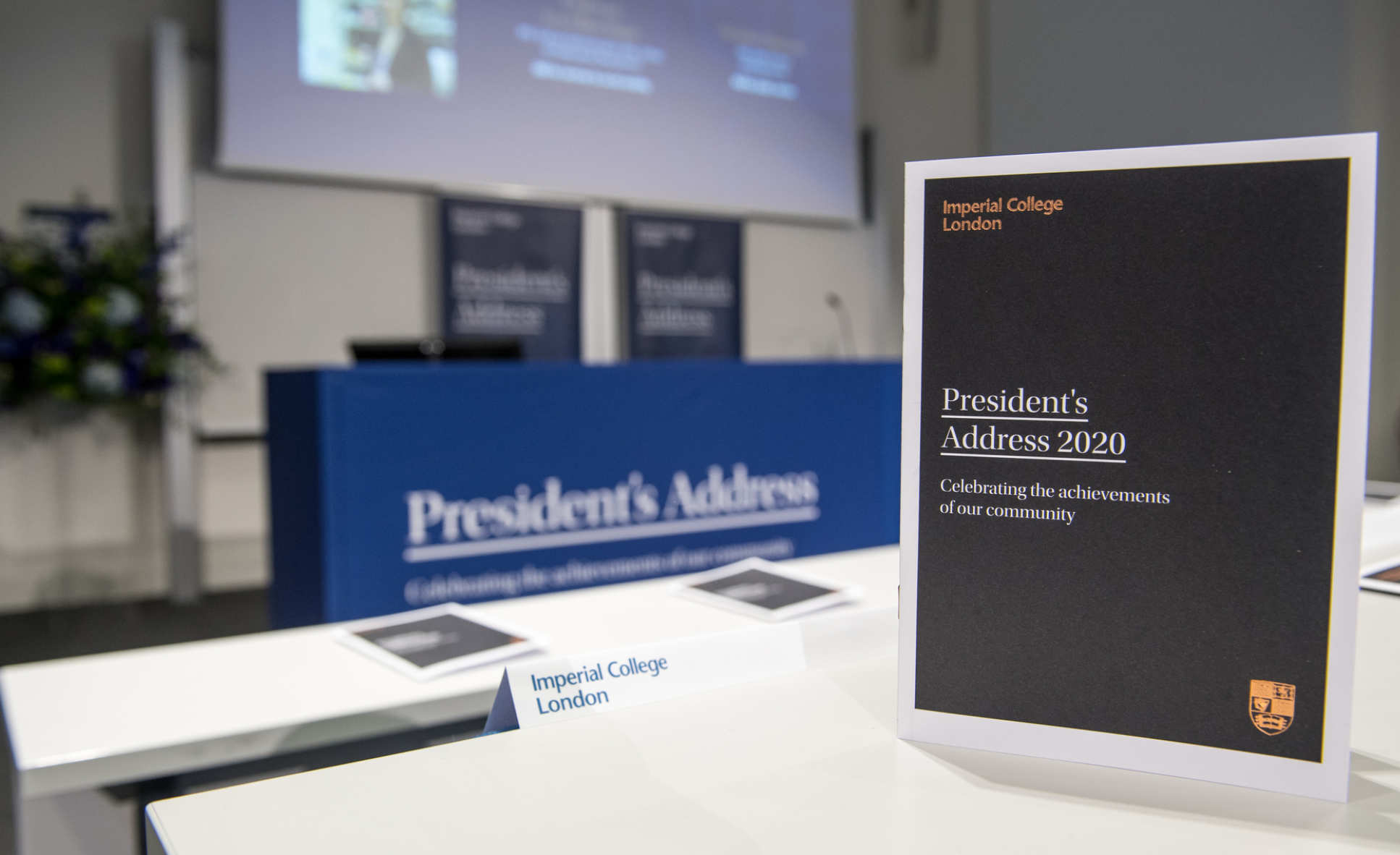 A lecture theatre set up for the 2020 President's Address, with a copy of the event programme showing the Imperial crest in the foreground