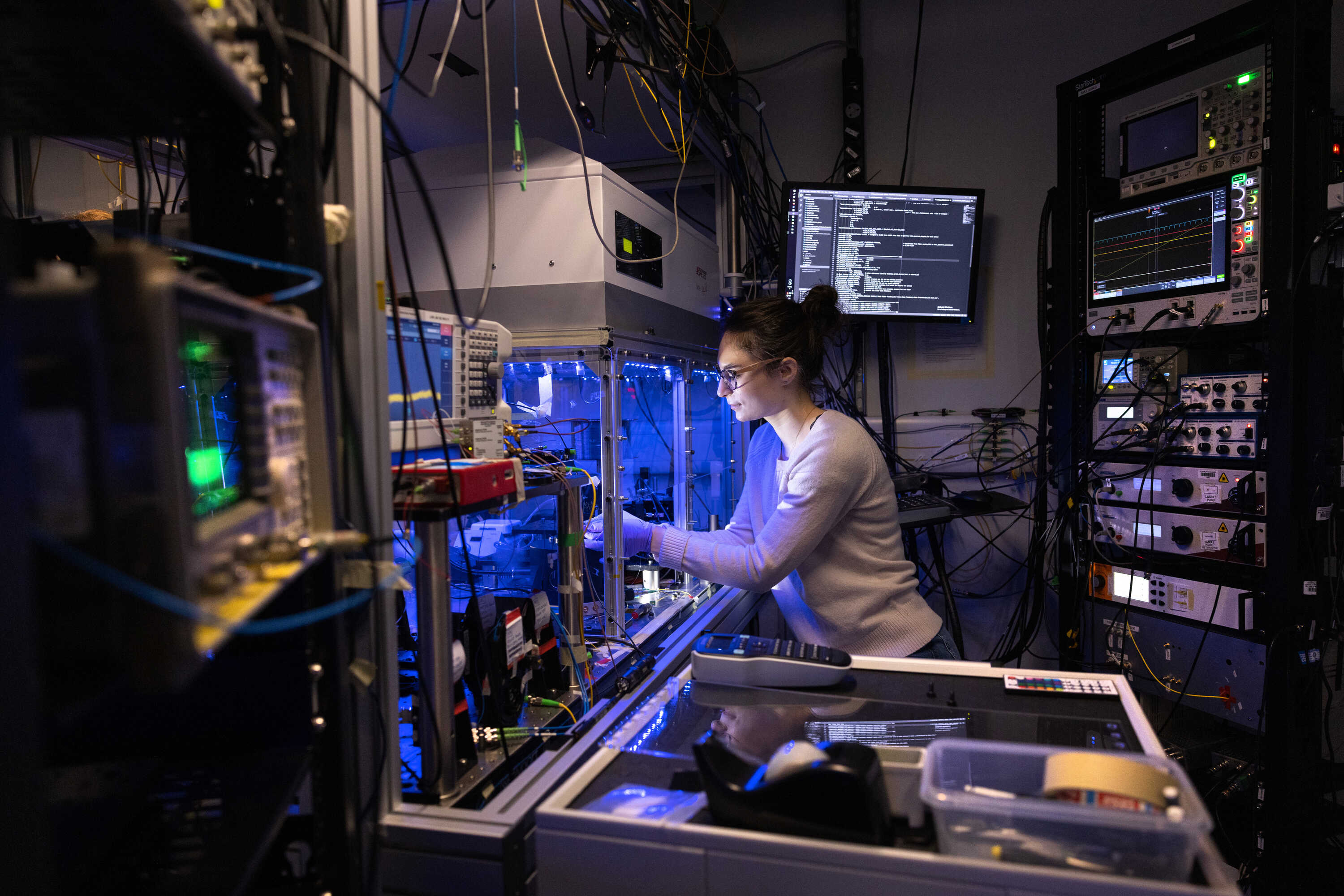 A PhD student studying in the lab