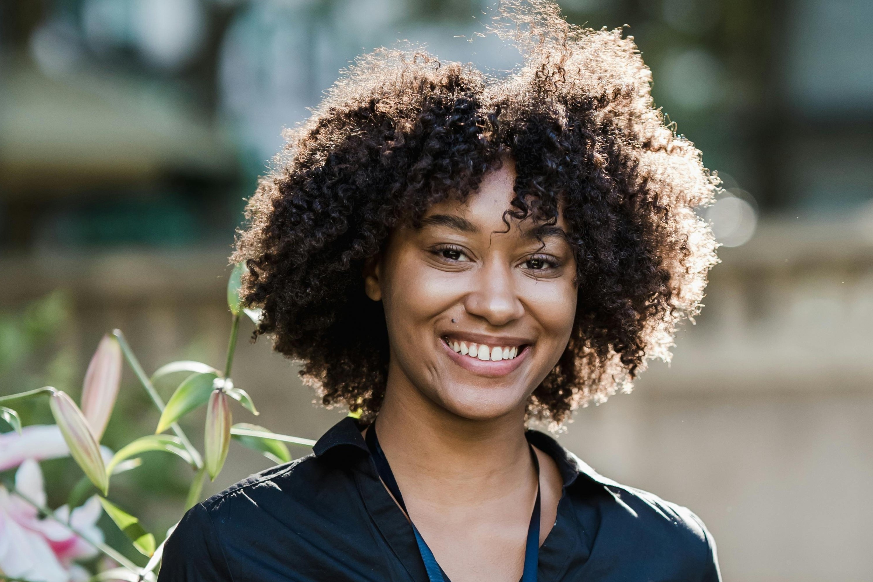 Smiling graduate outdoors in spring