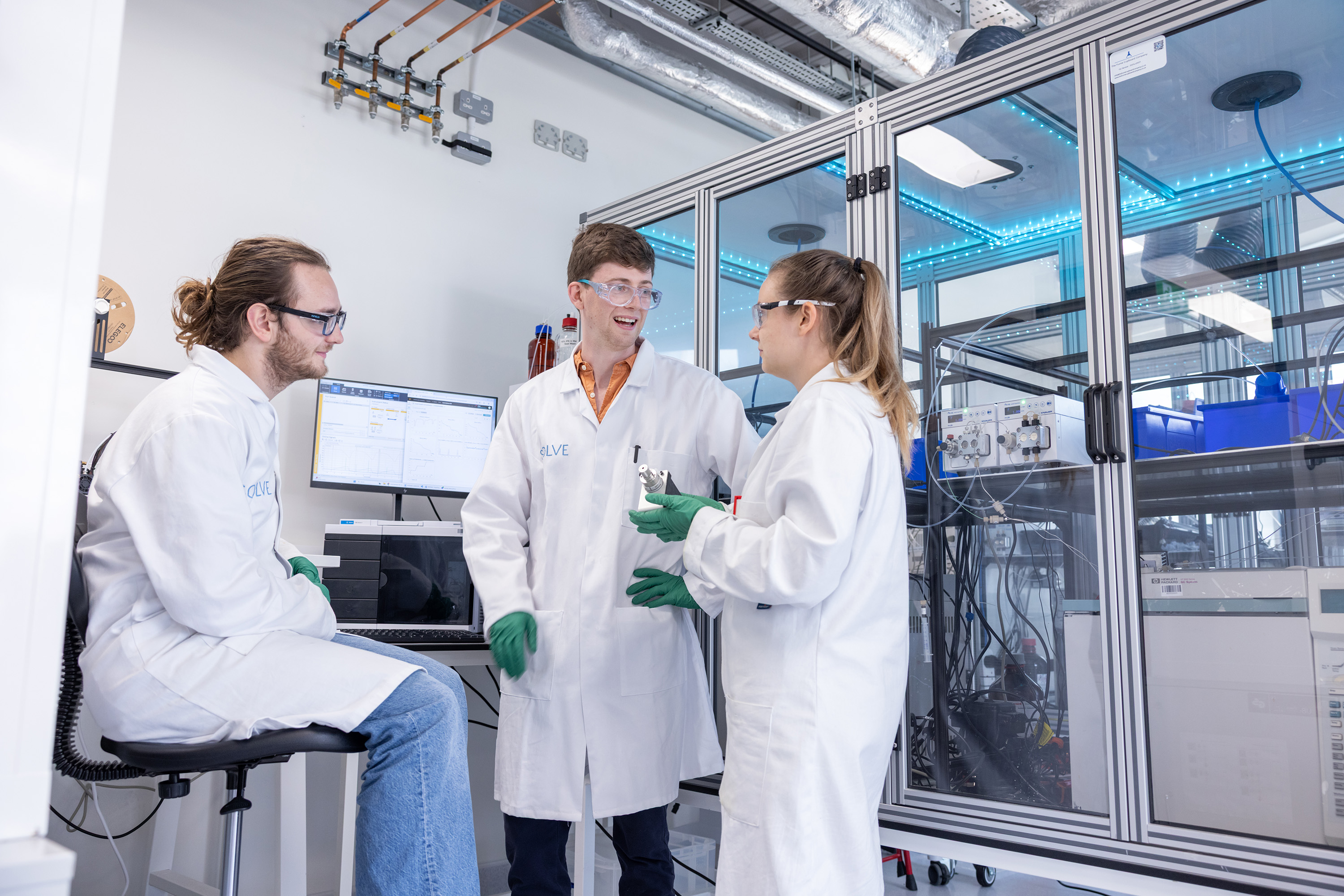 Three people in lab coats